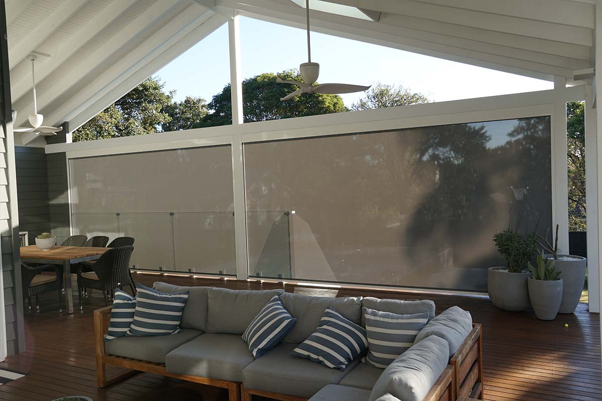 Grey outdoor blinds for modern outdoor seating area