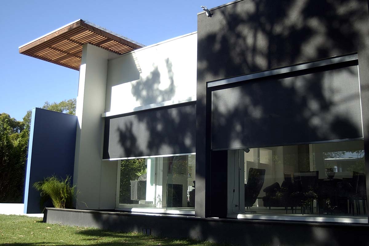Black outdoor blinds adding shade for modern home