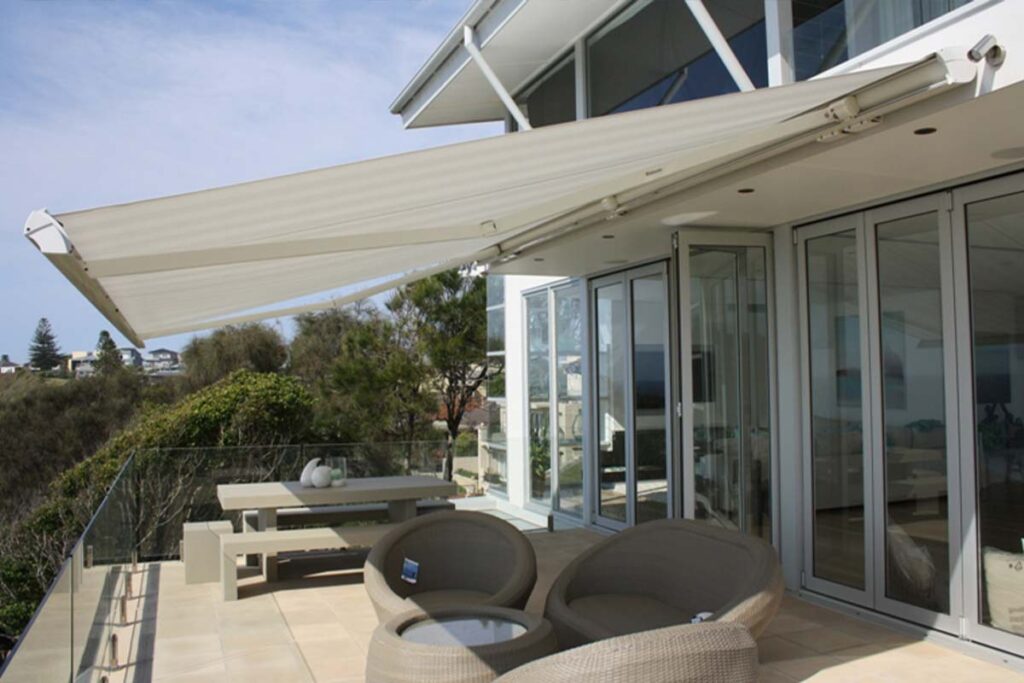 White retractable awning for modern outdoor balcony