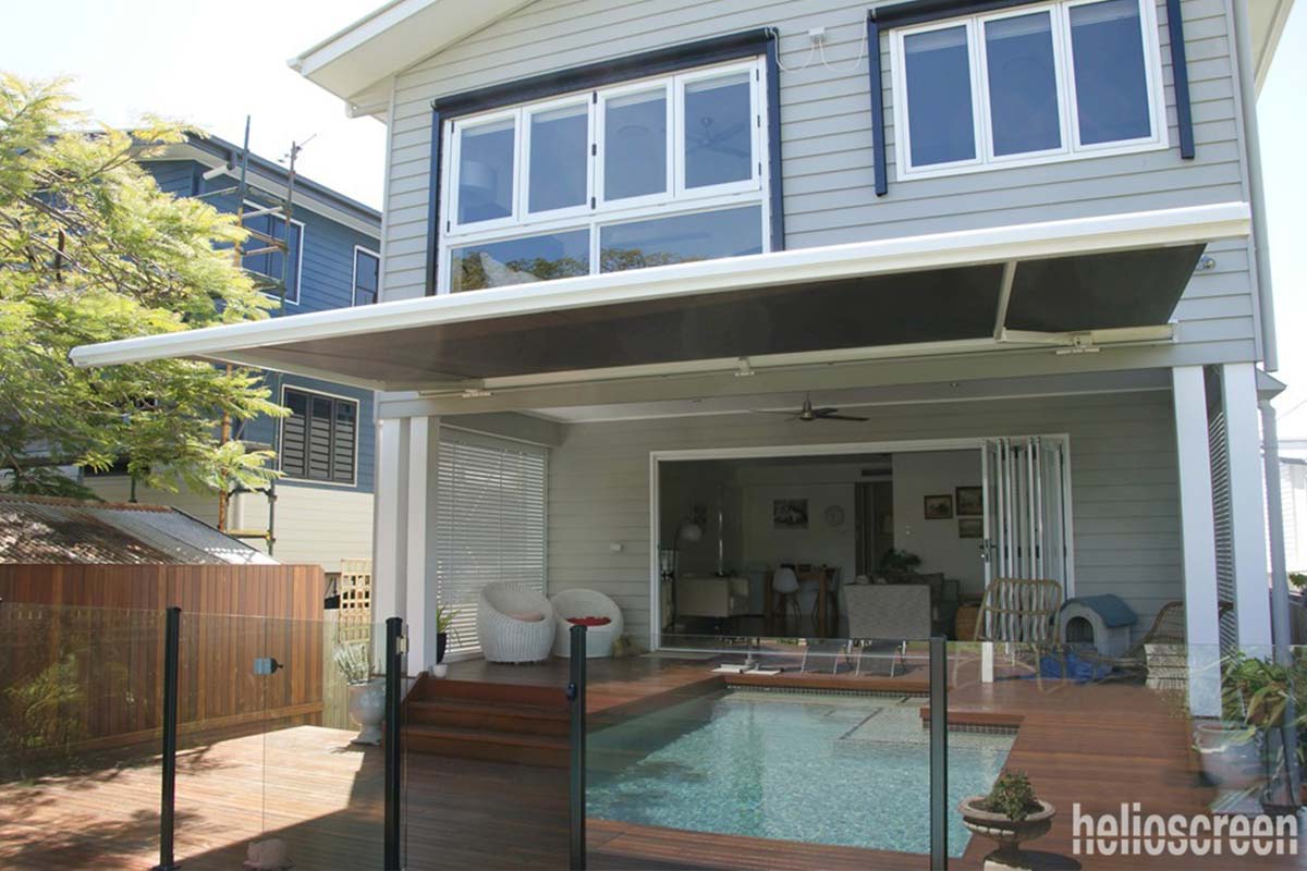 Retractable awning covering outdoor pool