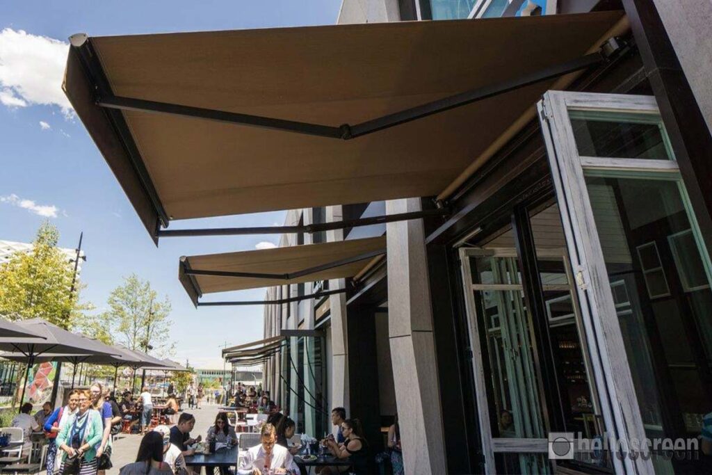 Retractable awning adding shade for outdoor restaurant