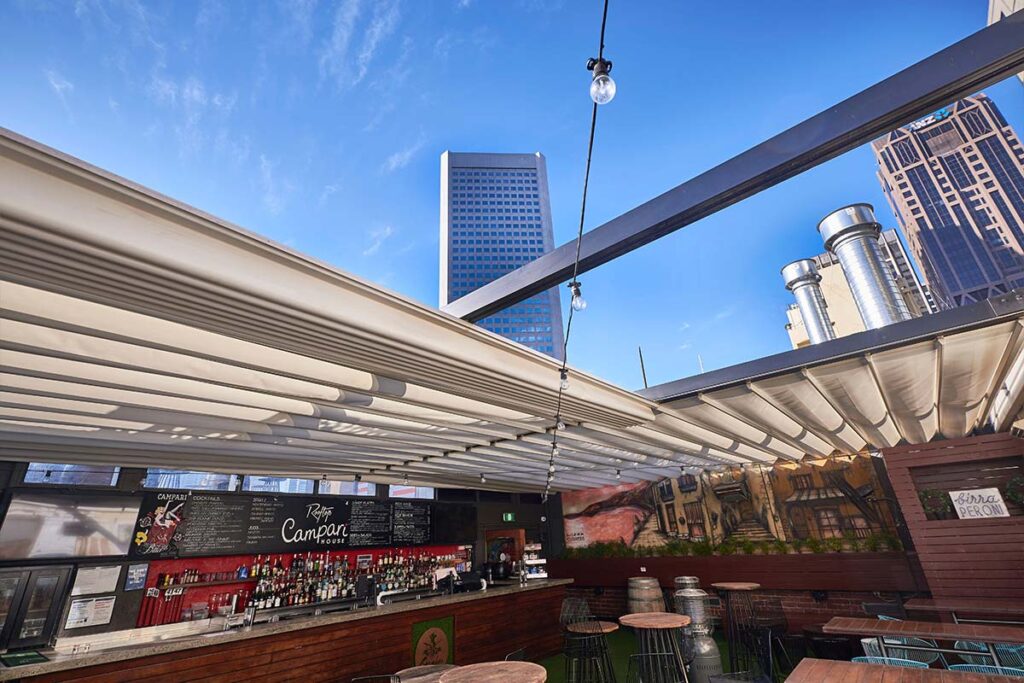 Retractable roof system above outdoor bar