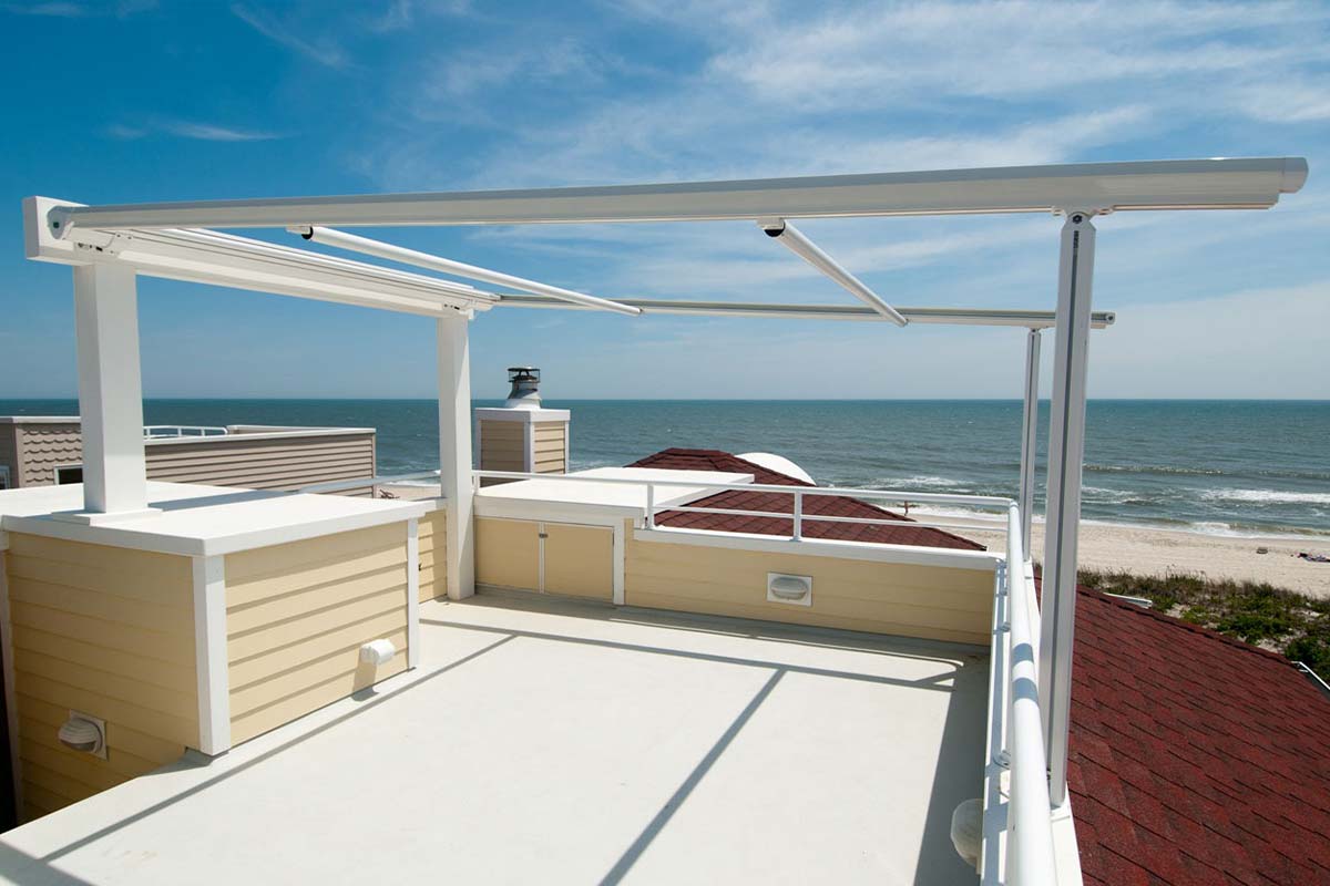 Retractable pergola for rooftop with view of beach